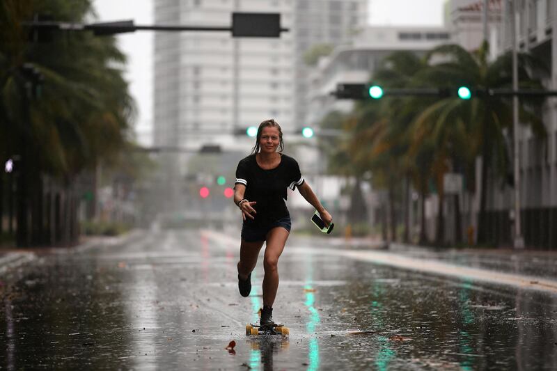A local resident rides a skateboard before the arrival of Hurricane Irma in Miami Beach, Florida. Carlos Barria / Reuters