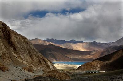 In this Sept. 14, 2017, photo, Pangong Tso lake is seen near the India China border in India's Ladakh area. India and China sought Wednesday, June 17, 2020, to de-escalate tensions following a fatal clash along a disputed border high in the Himalayas that left 20 Indian soldiers dead. The skirmish Monday in the desolate alpine area of Ladakh, in Kashmir, followed changes by India to the political status of Kashmir amid a geopolitical tug-of-war with the United States in the region. (AP Photo/Manish Swarup)