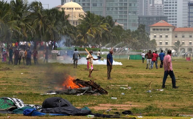 Sri Lanka's pro-government supporters vandalise camps of anti government protestors outside the president's office in Colombo. AP Photo