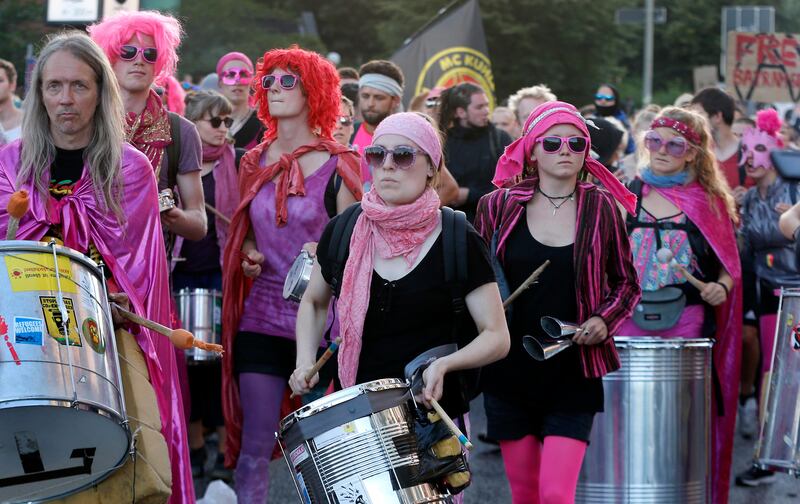 Protesters drumming during a protest against the G20 summit in Hamburg. Michael Probst / AP Photo