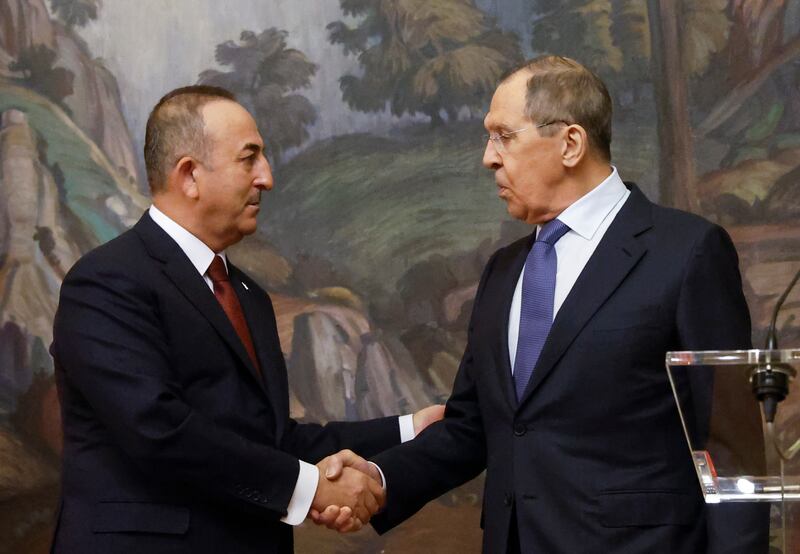 Russian Foreign Minister Sergey Lavrov, right, and Turkish Foreign Minister Mevlut Cavusoglu shake hands during a news conference following their talks in Moscow, Russia. EPA
