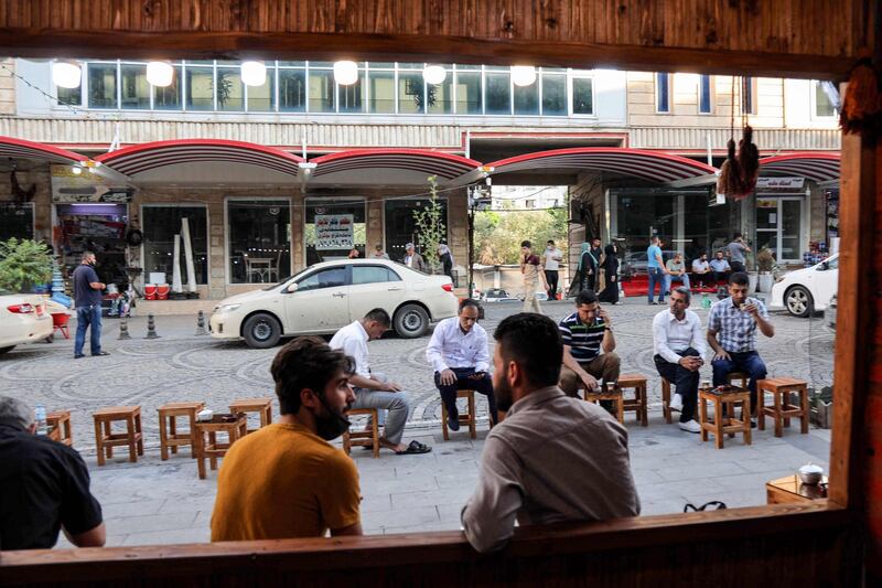 Men sit at a traditional cafe in the historic city of Shaqlawah, about 48 kilometres northeast of Erbil, in the northern Iraqi Kurdish autonomous region. AFP