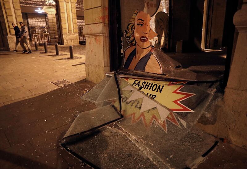 A window shop smashed by anti-government protesters is seen during a protest against the new government, in downtown Beirut. AP Photo
