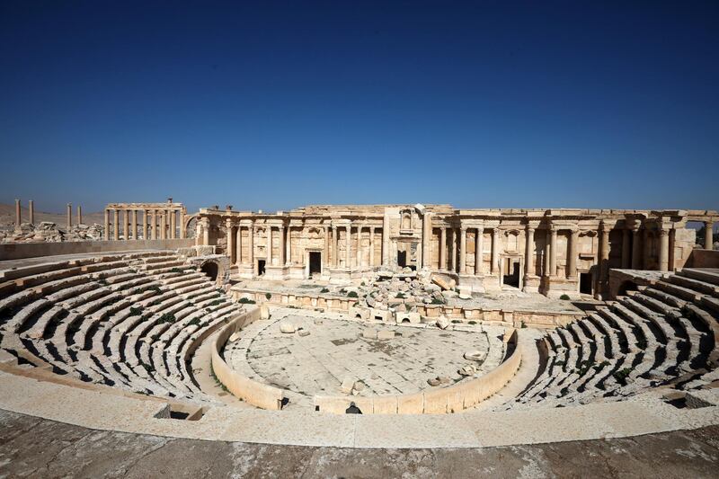 A picture shows a partial view of the damaged amphitheatre, in Syria's Roman-era ancient city of Palmyra on February 7, 2021, in the country's central province of Homs. - Syria has six sites listed on the UNESCO elite list of world heritage and all of them sustained some level of damage in the 10-year war. Besides Palmyra and Aleppo, the ancient cities of Damascus and Bosra also sustained some damage. (Photo by LOUAI BESHARA / AFP)
