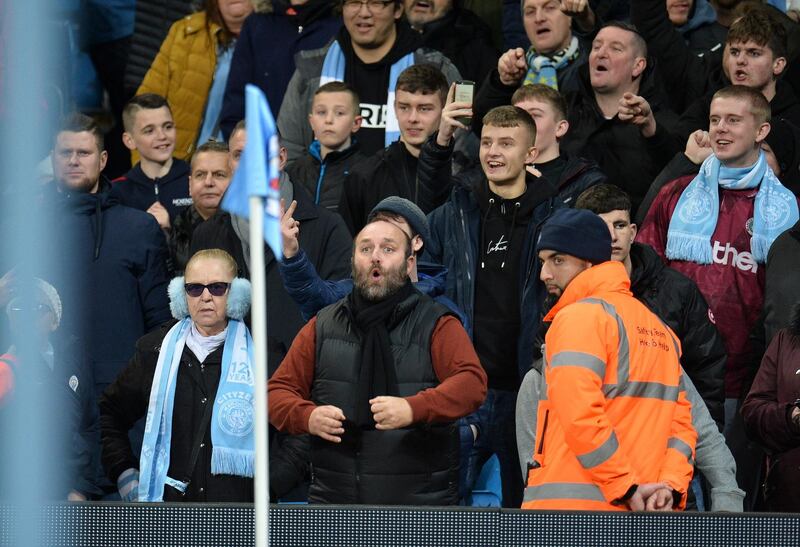 Manchester City supporters at a corner taken by Fred. EPA