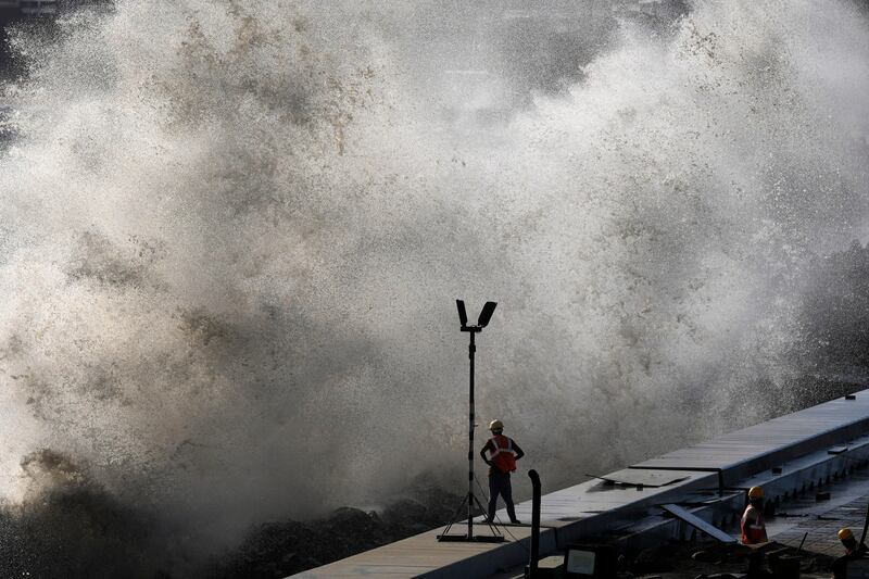 People have been urged to stay away from the coast, with concerns of high waves as seen in Mumbai. AP