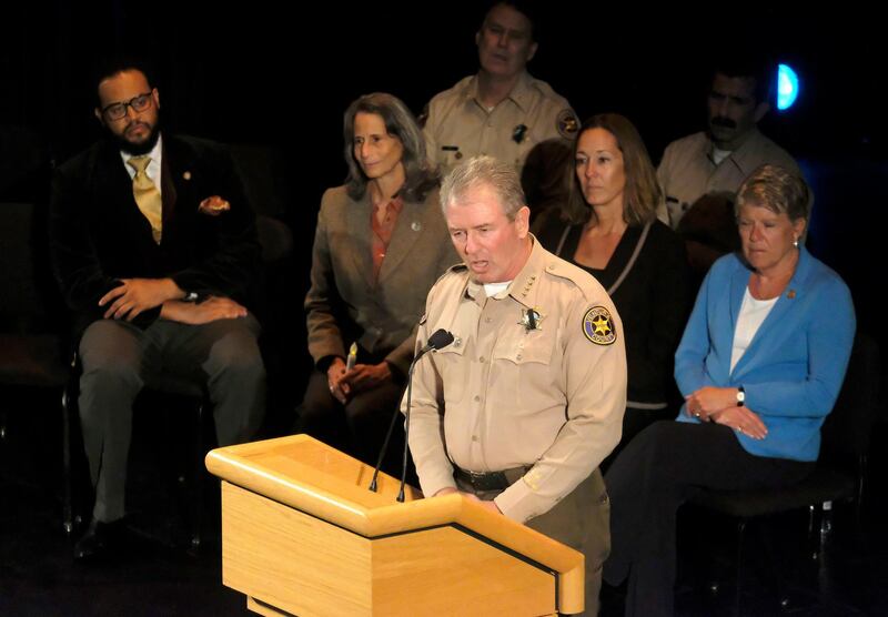 Ventura County Sheriff Geoff Dean, front, speaks during a candlelight vigil. AP Photo