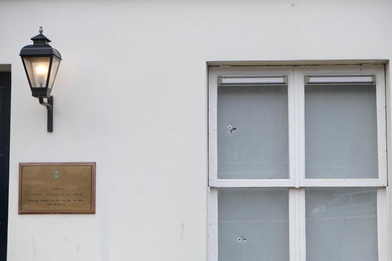 Bullet impacts are seen in the windows of Saudi Arabia's embassy in The Hague, Netherlands. AP