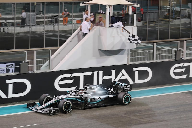 Mercedes driver Lewis Hamilton of Britain crosses the finish line during the Emirates Formula One Grand Prix, at the Yas Marina racetrack in Abu Dhabi, United Arab Emirates, Sunday, Dec.1, 2019. (AP Photo/Kamran Jebreili)