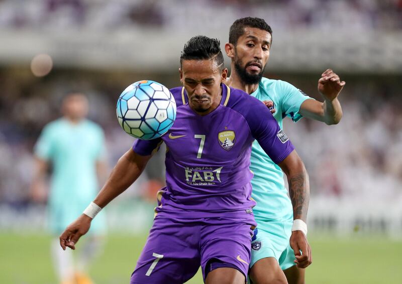 Al Ain, United Arab Emirates - August 21st, 2017: Al Ain's Caio and Al Hilal's Salman Alfaraj during the Asian Champions League game between Al Ain v Al Hilal. Monday, August 21st, 2017 at Hazza Bin Zayed Stadium, Al Ain. Chris Whiteoak / The National