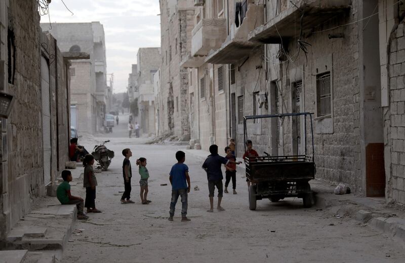 Children play in a street on the southern outskirts of the Syrian city of al-Bab. Khalil Ashawi / Reuters