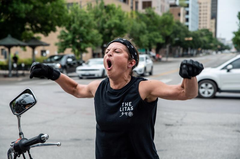 A Black Lives Matter protester reacts towards people protesting against mandates to wear masks amid the pandemic in Austin, Texas this week. Reuters