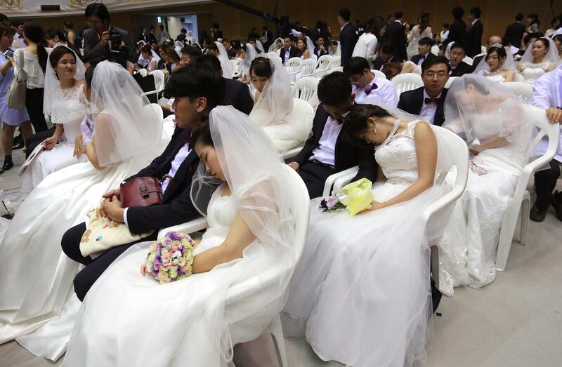 Brides takes a nap. Ahn Young-joon / AP Photo
