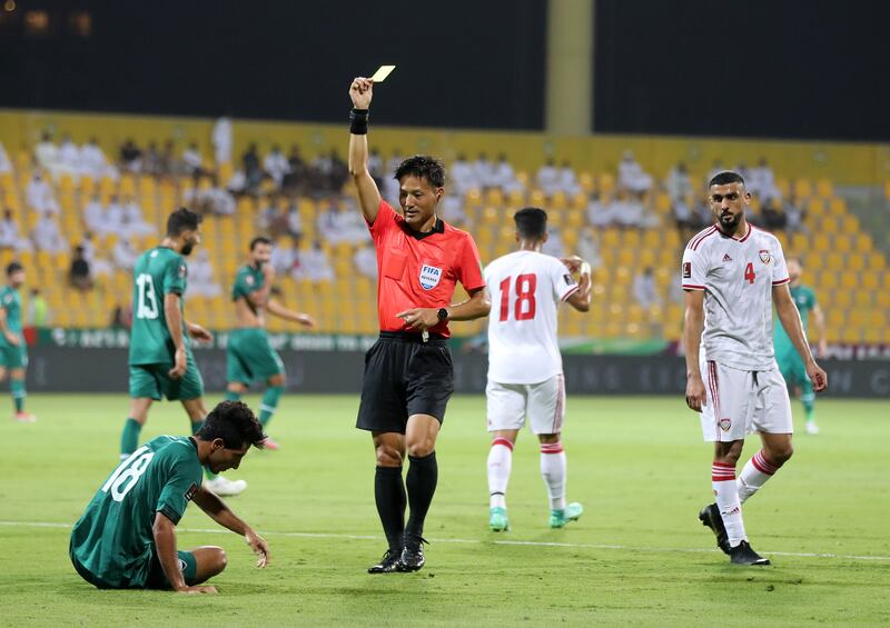 An Iraq player is booked for simulation in the 2-2 draw. Chris Whiteoak / The National
