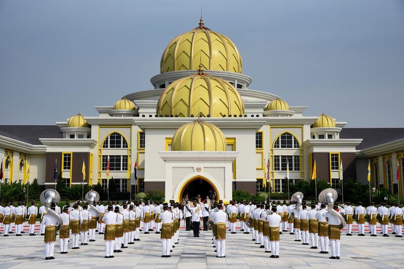 Malaysian honour guards saluting during an event to mark the coronation of Malaysia's new king. EPA