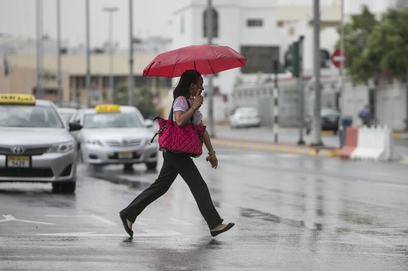 Abu Dhabi residents woke up to a gloomy and rainy weather on Wednesday morning, March 26 2014. Silvia Razgova / The National