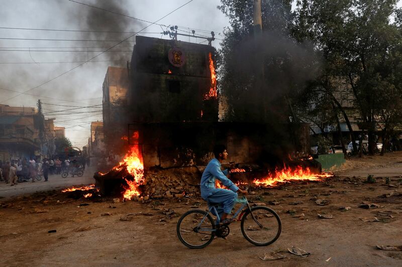 A paramilitary checkpoint burnt down during a protest in Karachi. Reuters