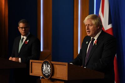 Alok Sharma with Boris Johnson at a press conference in Downing Street last November. AFP