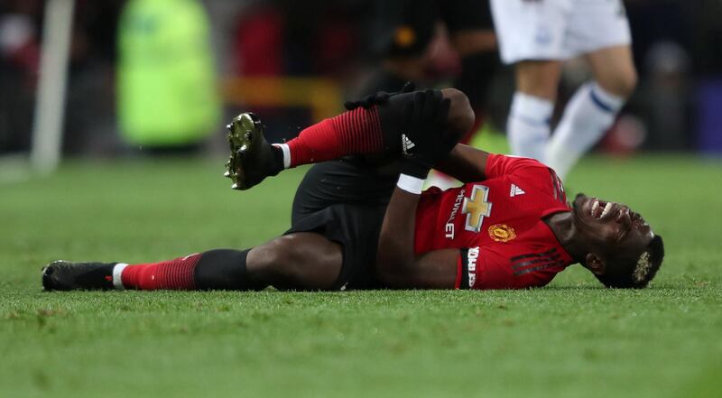Pogba reacts after sustaining an injury. Action Images via Reuters