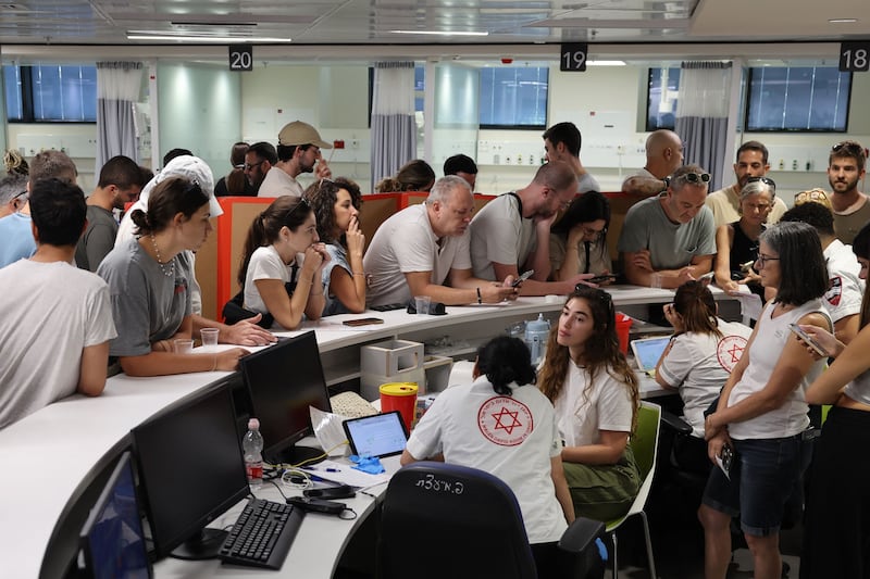 Israelis queue to donate blood at a hospital in Tel Aviv, to help people wounded in the Palestinian attacks. AFP