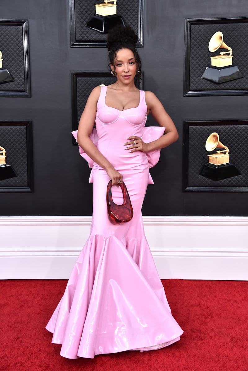 Tinashe, wearing a pink latex dress. AP