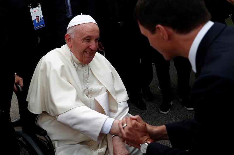 Pope Francis is welcomed by Canada's Prime Minister Justin Trudeau after arriving at Edmonton International Airport on Sunday. Reuters