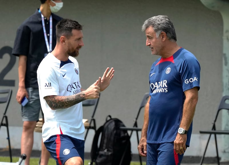 Paris Saint-Germain's Lionel Messi chats with new head coach Christophe Galtier. EPA