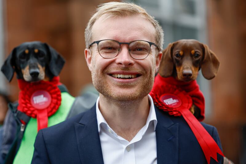Dachshunds Allan and Stanley show their preference for the Scottish Labour candidate for Rutherglen and Hamilton West, Michael Shanks, at a polling station where he cast his vote on October 5 in Rutherglen, Scotland. Getty Images