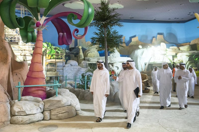 YAS ISLAND, ABU DHABI, UNITED ARAB EMIRATES -  March 1, 2018: HH Sheikh Mohamed bin Zayed Al Nahyan, Crown Prince of Abu Dhabi and Deputy Supreme Commander of the UAE Armed Forces (center L), inspects construction of Warner Bros World Abu Dhabi, with and HE Mohamed Khalifa Al Mubarak Chairman of the Department of Culture and Tourism and Abu Dhabi Executive Council Member (center R). 
( Ryan Carter for the Crown Prince Court - Abu Dhabi )
---