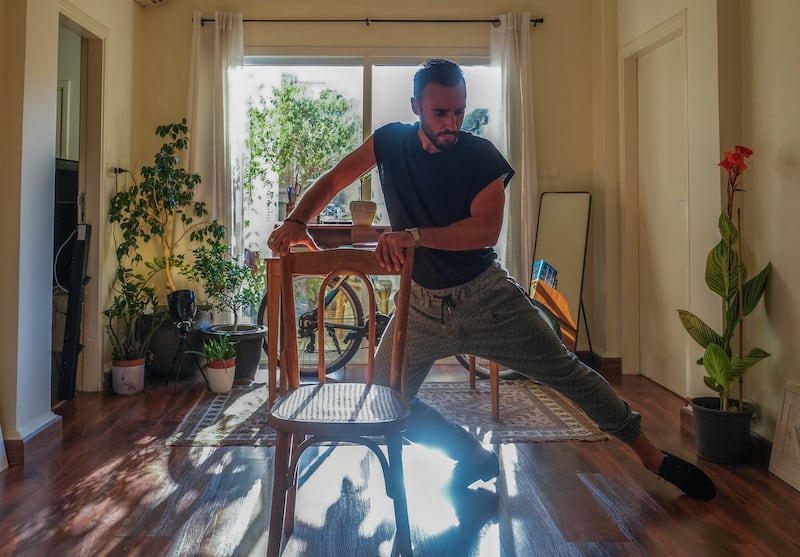 Equally determined to stay is ballroom dancer Amin Beitamouni, pictured practising in his Beirut home. Dancing has been his lifeline during tough times, he says.
