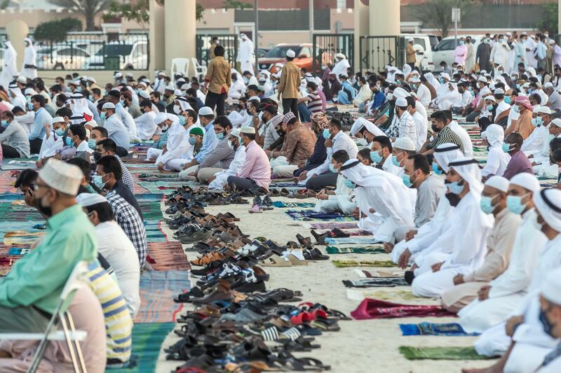 Eid prayers, also known as Salat al-Eid and Șālat al-'Īdayn, is the special prayers (salah) offered to celebrate the Islamic festival at the end of the Holy Month of Ramadan. Traditionally it is held in an open space, Eidgah, such as an allocated spcae or field specifically available for prayer. The UAE Authorities allowed communal Eid prayers again this year with a strict policy of social distancing anf a 15 minite prayer access throughout the UAE after last years locdown due to the Covid - 19 pandemic. Worshippers arrive in preparation for the Eid Prayer at the Umm Suquim Eid prayer grounds on May 13 th, 2021. 
Antonie Robertson / The National.
Reporter: None for National.