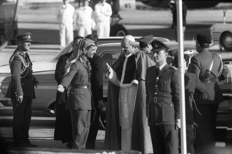 King Hussein I of Jordan (L) welcomes Pope Paul VI (R) on the tarmac of Amman's airport, on January 06, 1964, before the Pope leaves Amman to Roma, after his visit to the Holy Land. It is the first visit ever of a pope to the Holy Land (Jordan, Israel, Jerusalem and the Palestinian territories). (Photo by AFP)