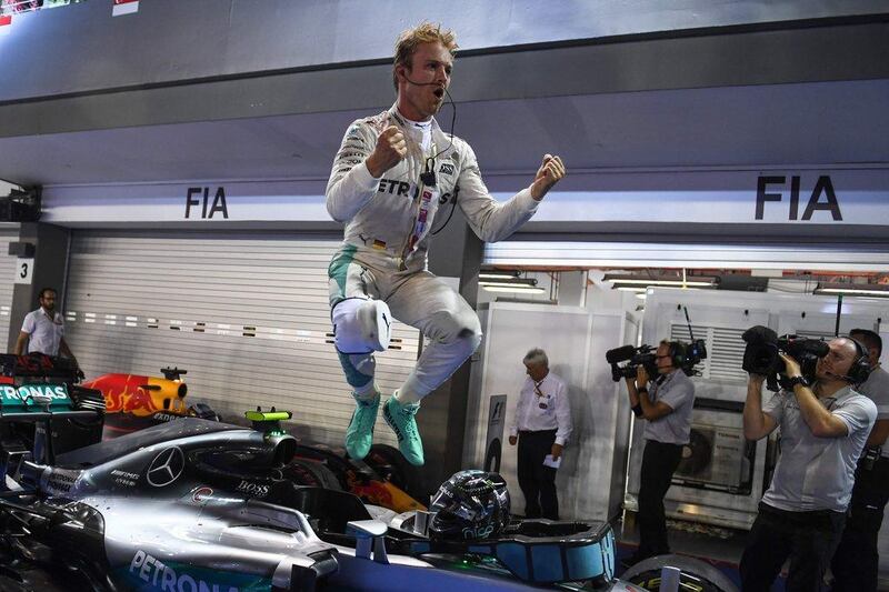 Mercedes driver Nico Rosberg jumps from his car as he celebrates winning the Singapore Grand Prix on Sunday. Mohd Rasfan / AFP / September 18, 2016