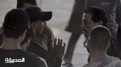 A scene from the TV show Al Sadma shows members of the public intervening following the smacking incident. Photo: MBC Iraq