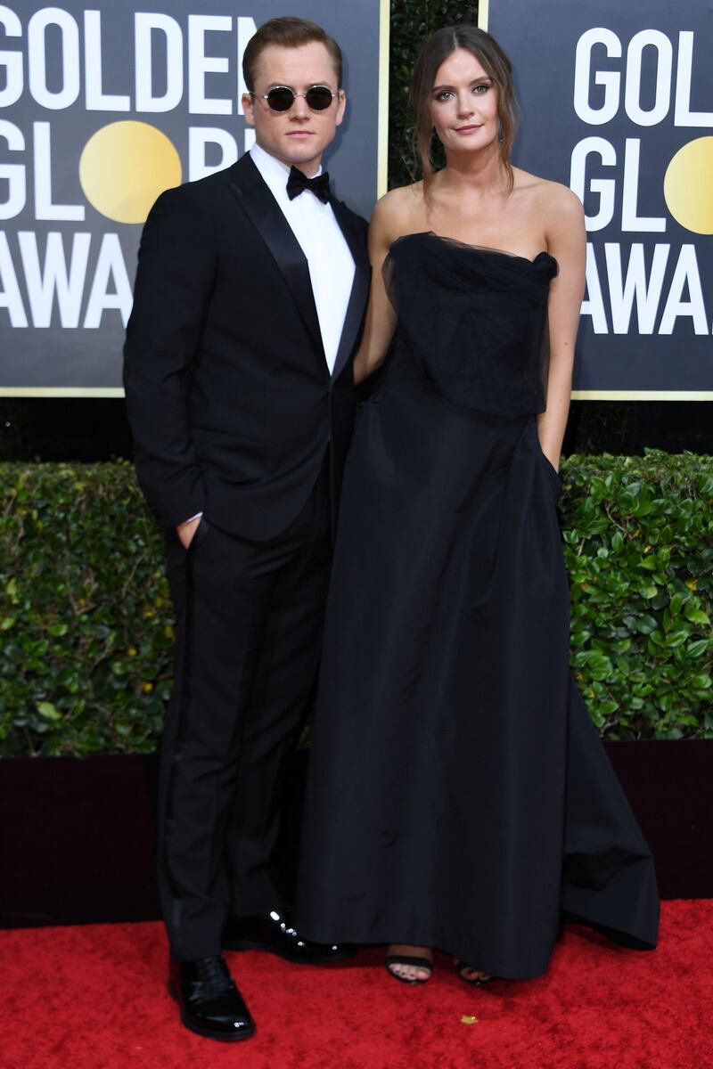 British actor Taron Egerton and Emily Thomas arrive for the 77th annual Golden Globe Awards. AFP