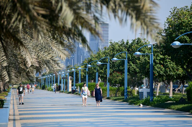 Taking a stroll along the Corniche in Abu Dhabi. Khushnum Bhandari / The National