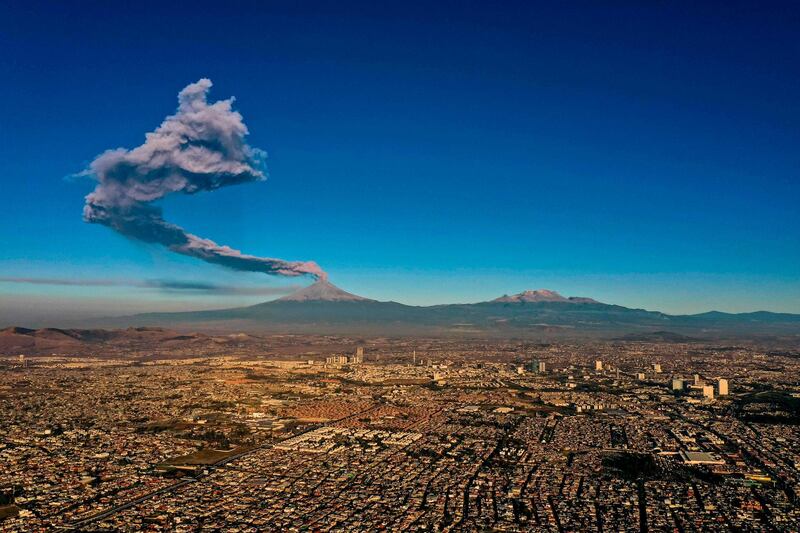 The Popocatepetl Volcano spews ash and smoke as seen from Puebla, central Mexico. AFP