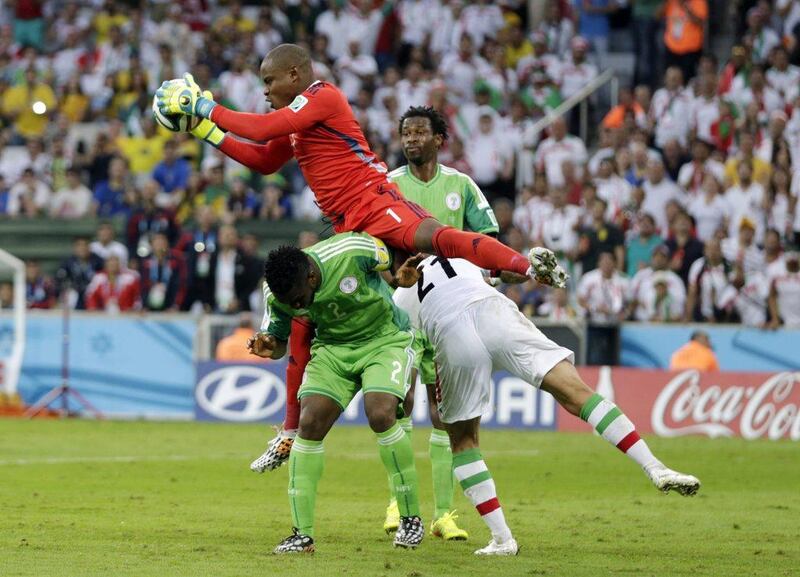 Nigeria keeper Vincent Enyeama makes a save against Iran in their Group F match at the 2014 World Cup on Monday. Fernando Vergara / AP / June 16, 2014