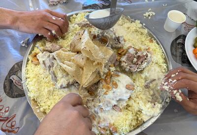 Intended for sharing and communal eating, mansaf is served on large platters layered with paper-thin shrak bread followed by rice, meat and a tangy sauce. Reuters