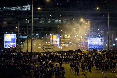 Demonstrators run from a cloud of tear gas during a protest in Hong Kong, China, early on Tuesday, July 2, 2019. Bloomberg