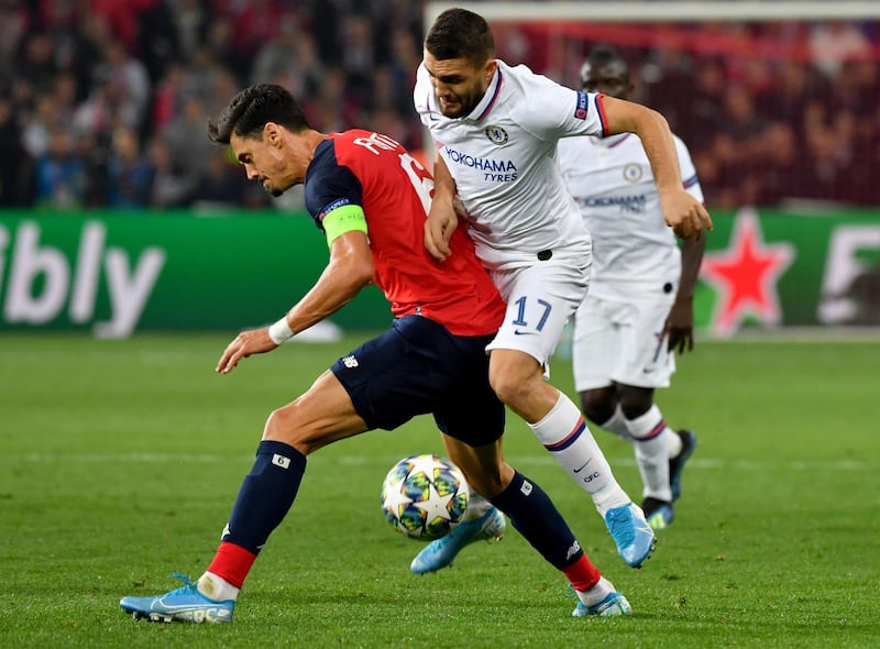 Lille's Jose Fonte, left, vies with Chelsea's Mateo Kovacic. AFP