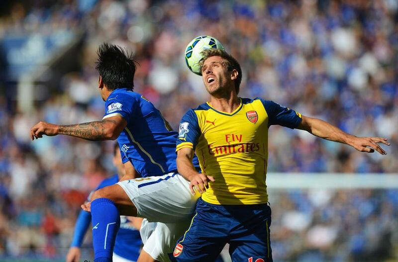 Nacho Monreal of Arsenal wins a header with Leonardo Ulloa of Leicester City during their Premier League match on Sunday. Michael Regan / Getty Images