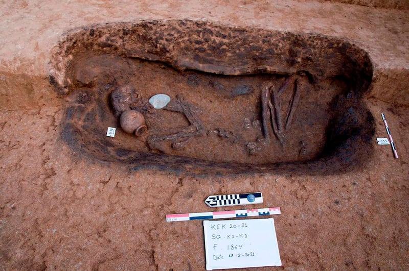 This photo provided by the Egyptian Tourism and Antiquities Ministry on Tuesday, April 27, 2021, shows an ancient burial tomb unearthed recently with human remains and and pottery, in the Koum el-Khulgan archeological site, in the Nile Delta province of Dakahlia, around 150 kilometers (93 miles) northeast of Cairo, Egypt. Archeologists unearthed 110 burial tombs in the ancient site in a Nile Delta province, Tourism and Antiquities Ministry said on Tuesday. (Egyptian Tourism and Antiquities Ministry via AP)