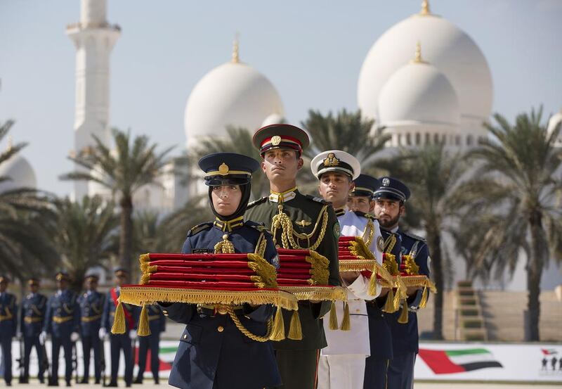 Members of the Armed Forces hold Martyrs’ Medals during the first Commemoration Day ceremony, honouring those who lost their lives in the performance of their duty. Ryan Carter / Crown Prince Court – Abu Dhabi