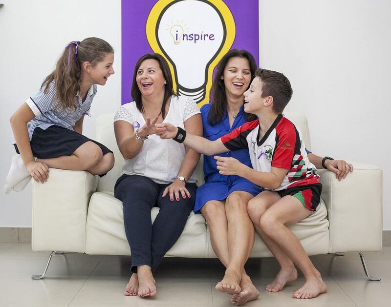 From left, Charlotte, 11, her mother, Heidi Pezzotta, Sema Faulkner, and her son Oliver, 9. Mrs Pezzotta and Mrs Faulkner have set up Inspire and are organising the Festival of Learning at The British School Al Khubairat in Abu Dhabi. Mona Al Marzooqi / The National