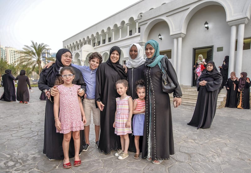 Abu Dhabi, United Arab Emirates, August 11, 2019.  Eid prayers at Zayed The 2nd Mosque. --  The Owais family gather together for a quick photo after Eid prayers.
Victor Besa/The National
Section:  NA
Reporter: Haneen Dajani