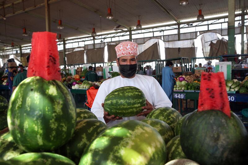 A man buys watermelon at the Mawaleh market in Oman's capital Muscat a day before the announcement of Ramadan. AFP