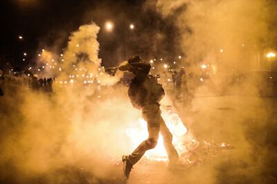Protesters clash with police in Lima, Peru, on December 15. EPA