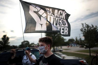 KENOSHA, WISCONSIN - AUGUST 28: A small group of peaceful demonstrators protesting the shooting of Jacob Blake hold a rally on August 28, 2020 in Kenosha, Wisconsin. Blake was shot seven times in the back in front of his three children by a police officer. The shooting has led to several days of rioting and protests in the city.   Scott Olson/Getty Images/AFP
== FOR NEWSPAPERS, INTERNET, TELCOS & TELEVISION USE ONLY ==
