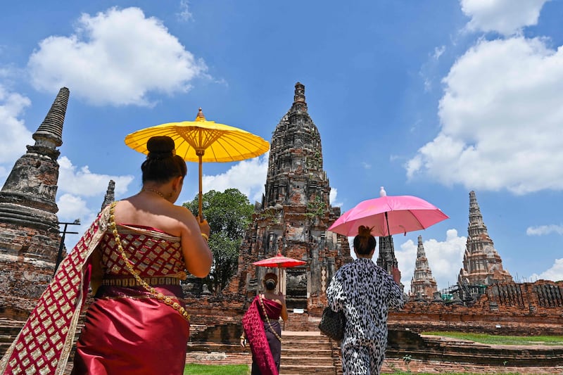 Visitors at the 17th century Wat Chaiwatthanaram temple complex in the ancient capital of Ayutthaya, north of Bangkok.  Photo by Romeo Gacad  /  AFP